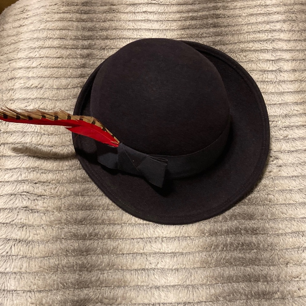 Frank Oliver Elegant Black Bowler Hat with Feather Detail.